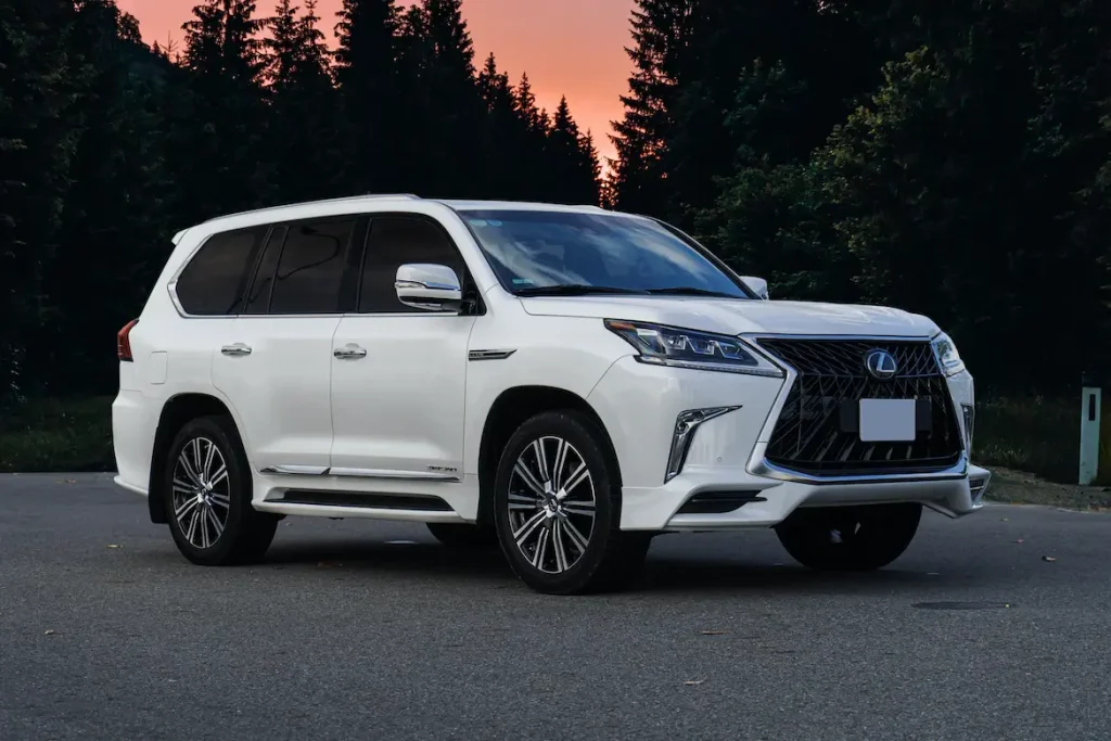 white Lexus lx570 in the forest
